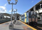 Bombardier Bilevel Cab Car # 511 bringing up the rear of P663 at the MIC. On the left is the Miami Intermodal Center Metrorail Station